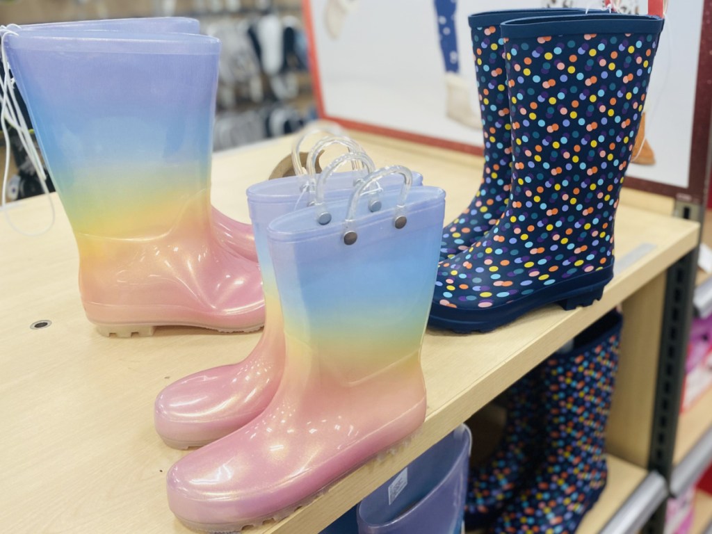 Three styles of kids boots on display in-store