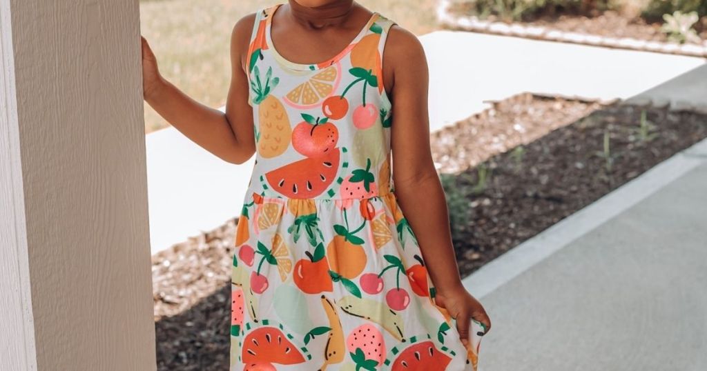 girl wearing a sleeveless dress