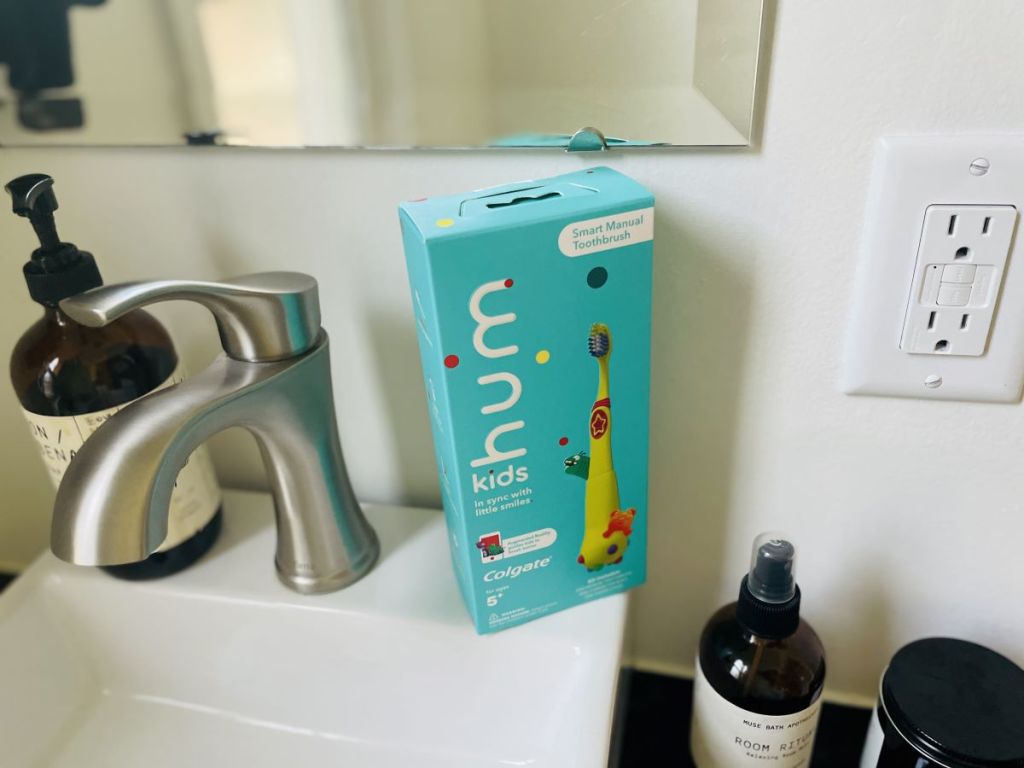 kids toothbrush box sitting on a sink