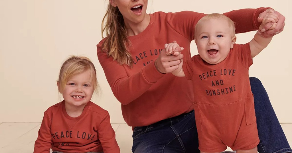 woman and two young children in matching apparel