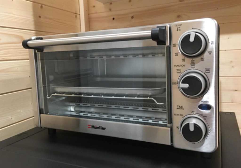 close up of stainless steel toaster oven on kitchen countertop