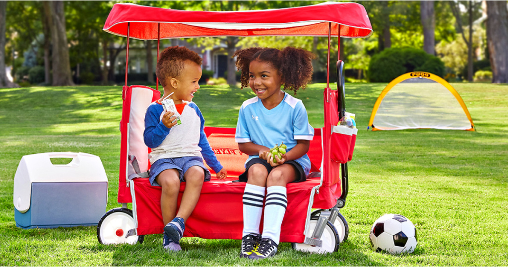 kids sitting in a wagon