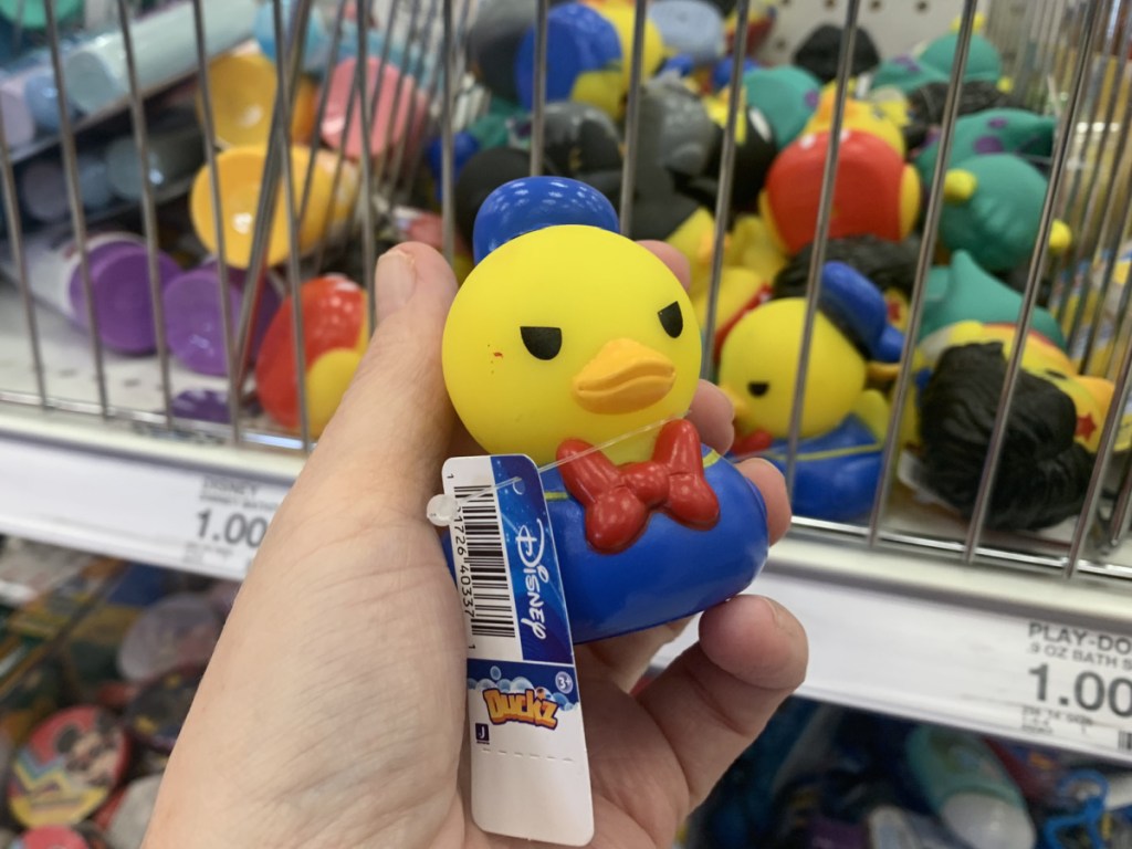 hand holding a donald duck duck