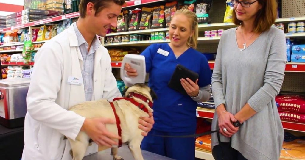 people with dog at Tractor Supply Co PetVet Clinic