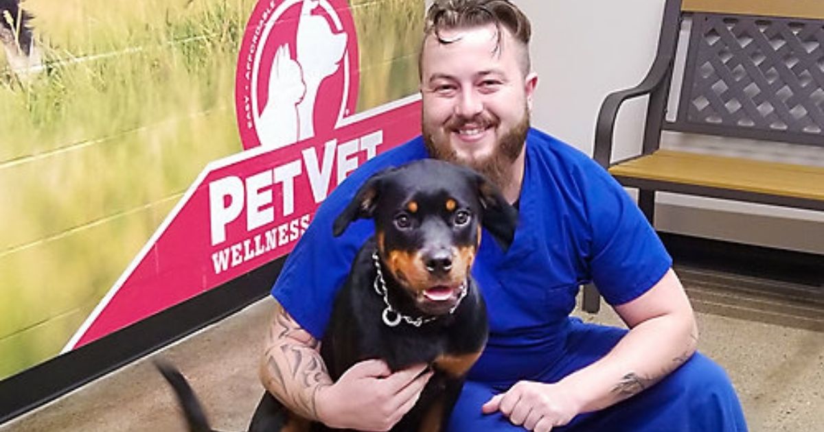 man and dog at Tractor Supply Co PetVet Clinic