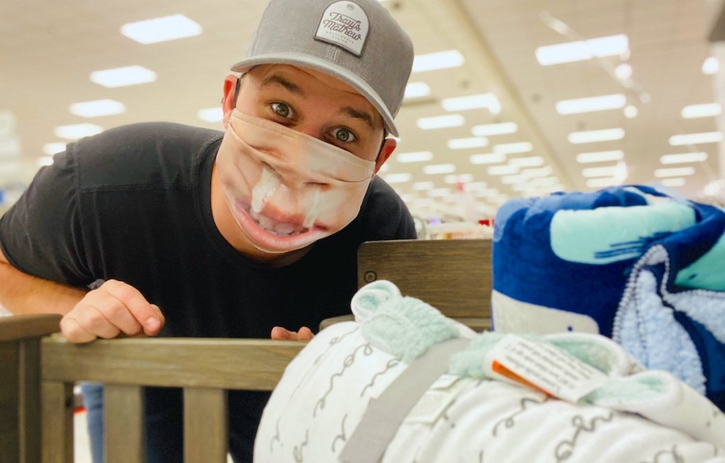 man wearing hat and runny nose face mask