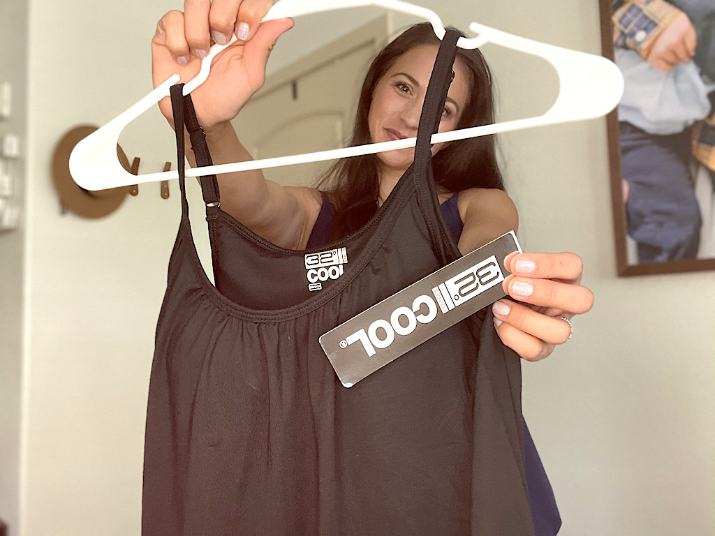 woman holding 32 Degrees tank top 