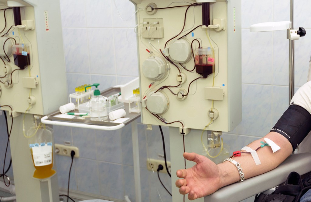 man sitting down for plasma donation