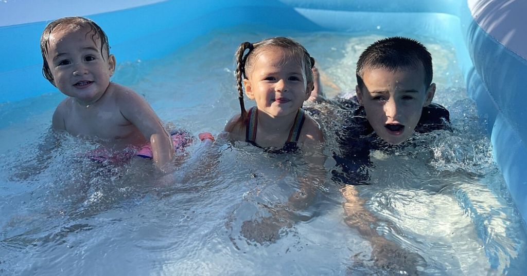 kids in sable inflatable pool