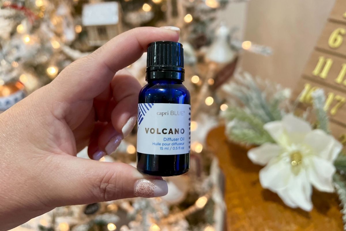 capri blue volcano diffuser oil in front of Christmas tree