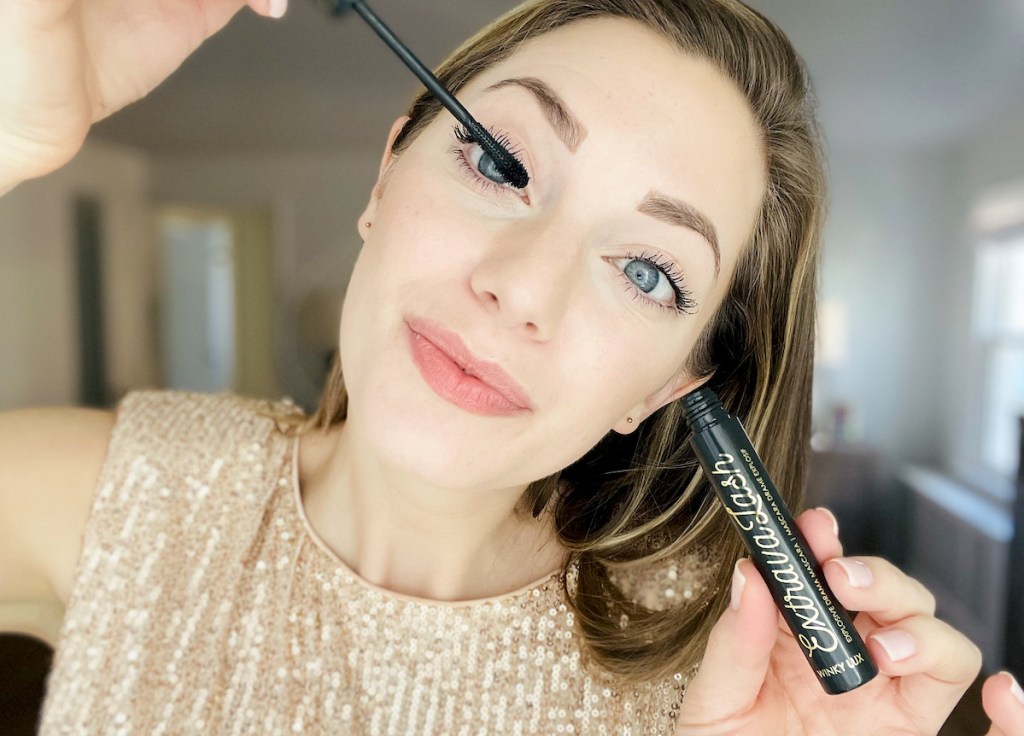 woman applying winky lux extravalash mascara on eyelashes