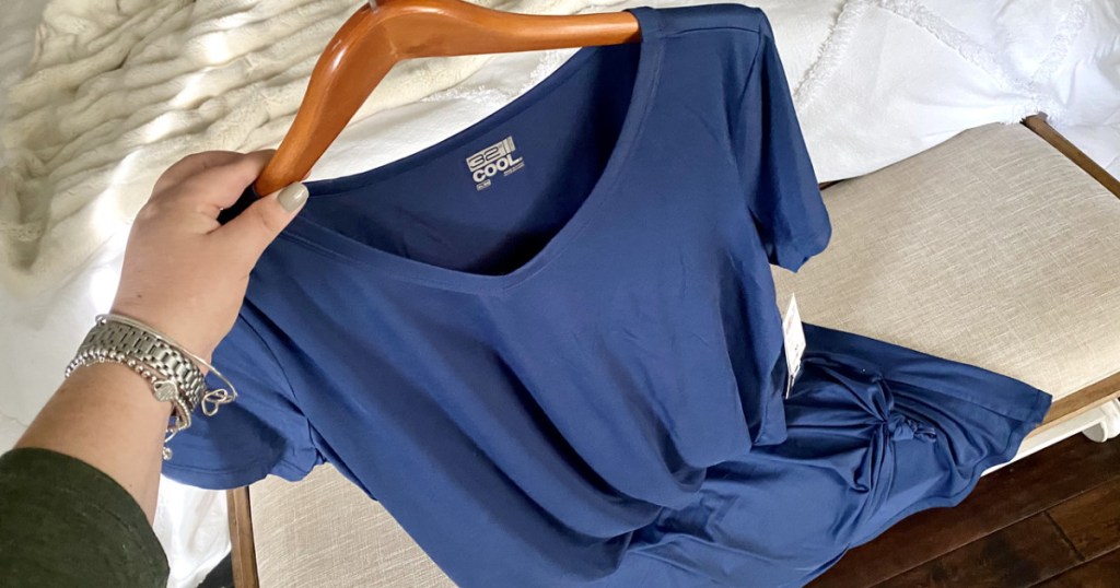 navy dress on a wooden hanger