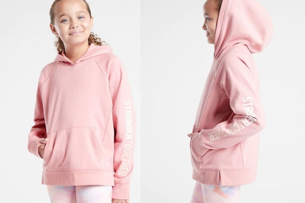 girl wearing Athleta Girl Stronger Together Sweatshirt