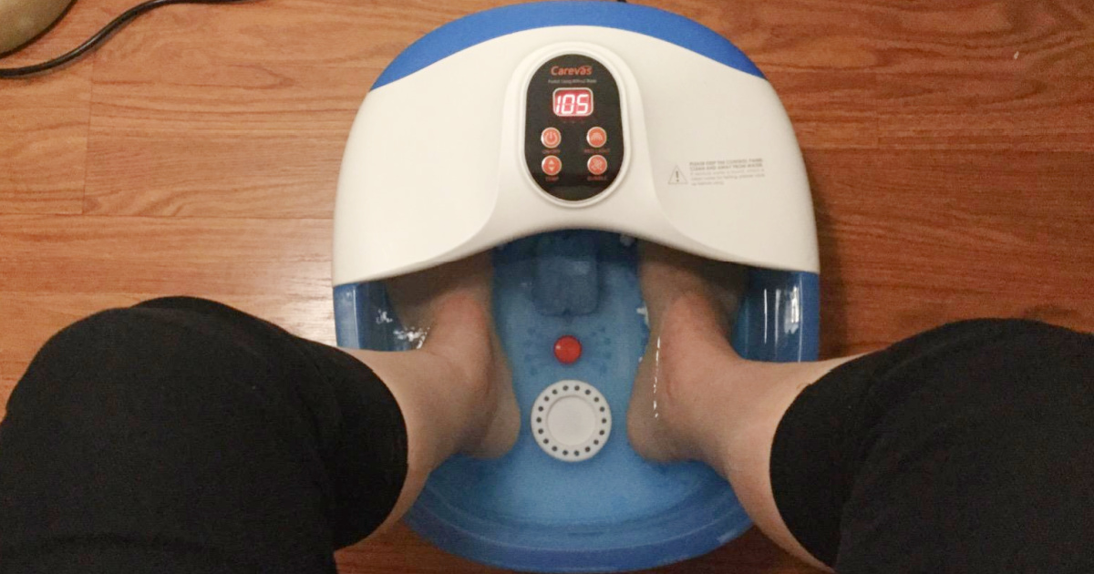 Woman soaking feet in foot tub