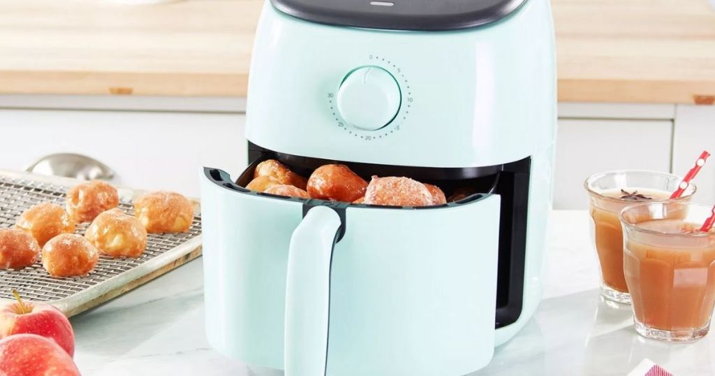 Dash Tasti-Crisp Express 2.6-qt Air Fryer on counter with food