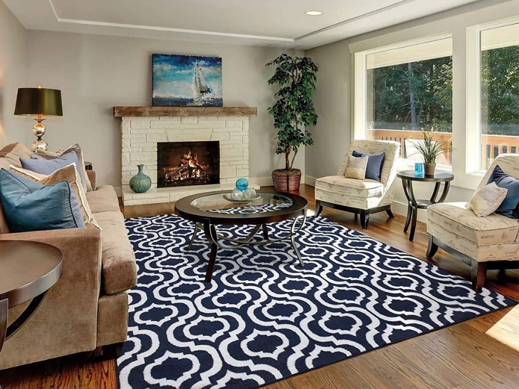 living room with fireplace, couches, chairs and coffee table