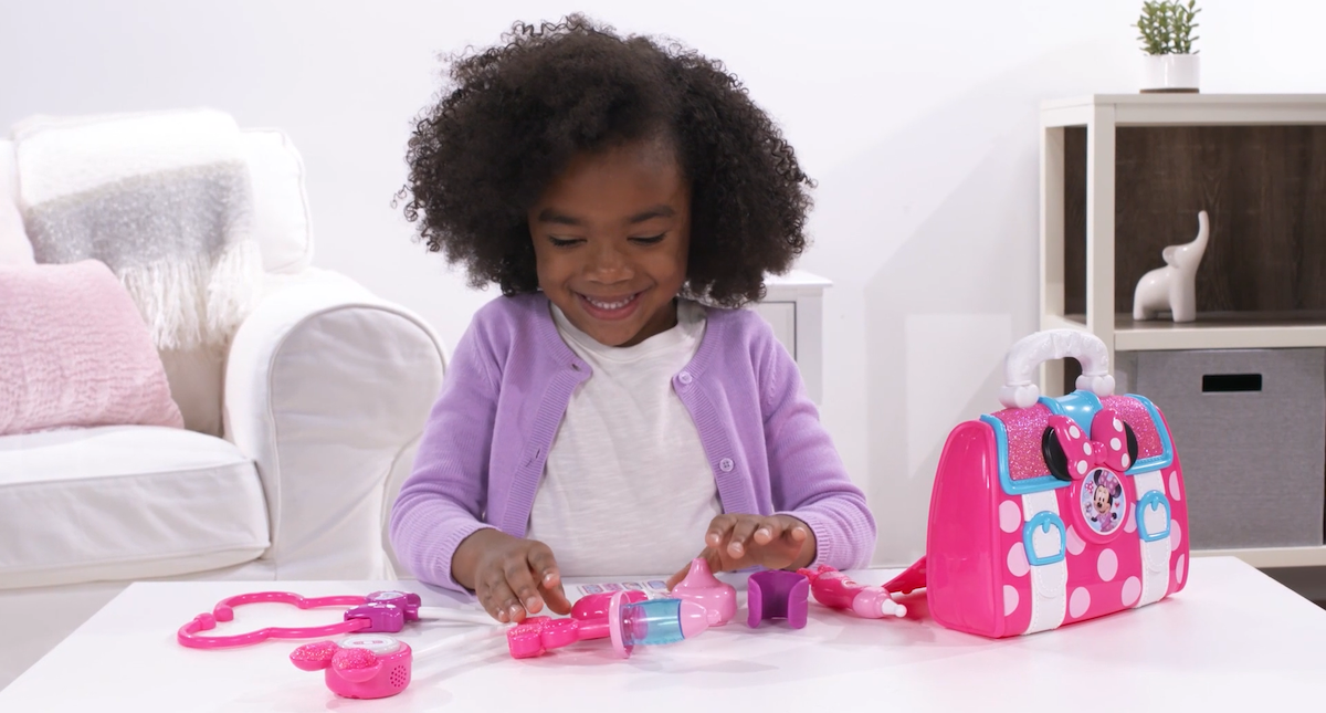 Girl Playing with Minnie Doctor Bag