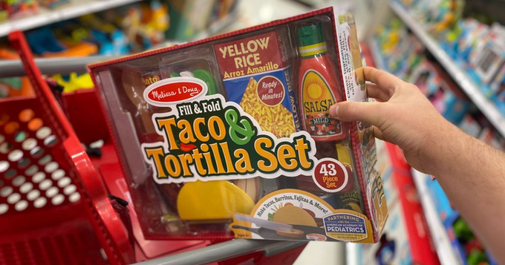 hand holding play taco food set 