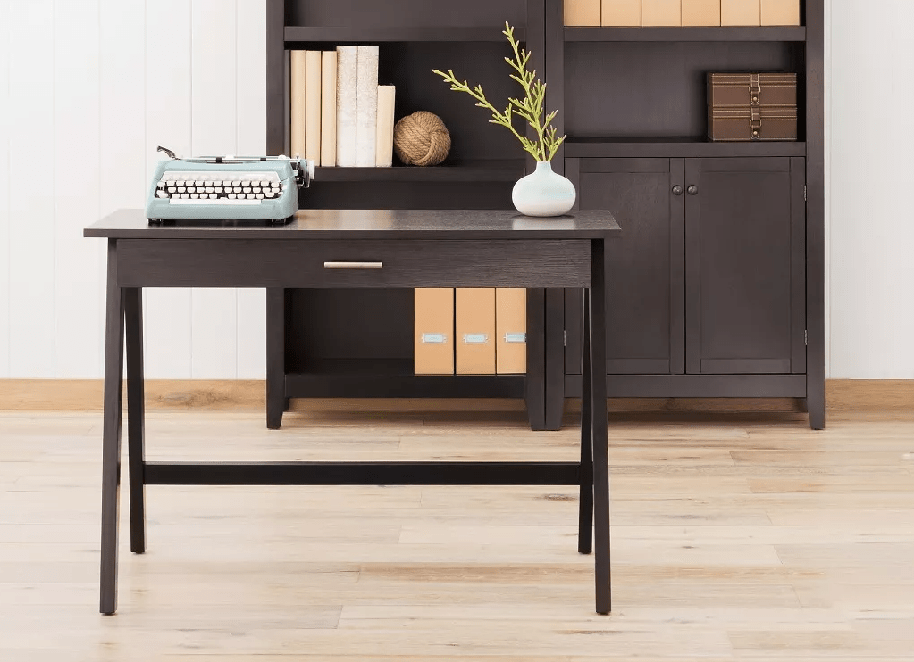 desk in front of a bookshelf