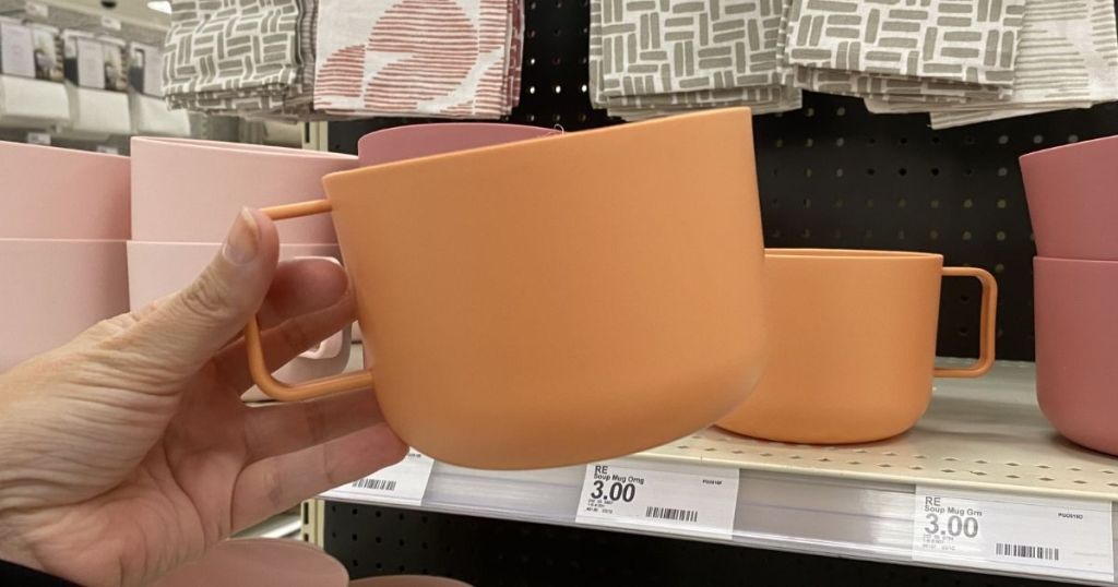hand holding a mug