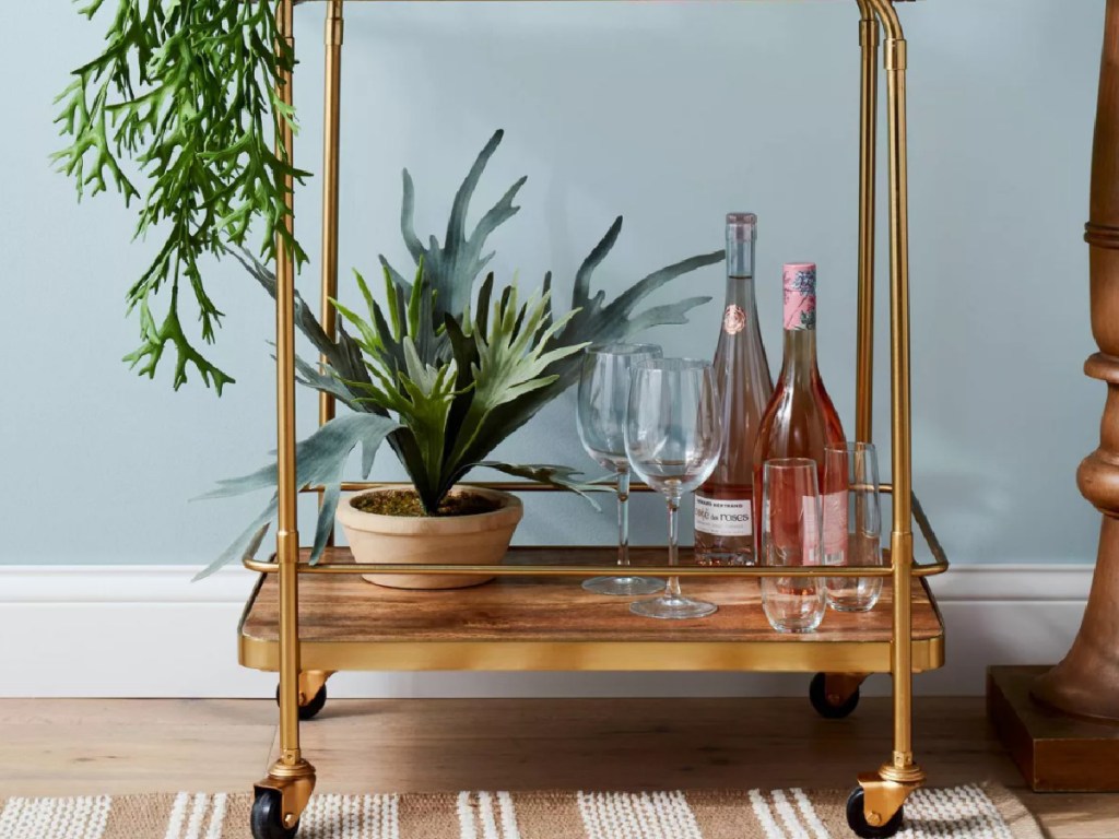 fake plant on brass cart 