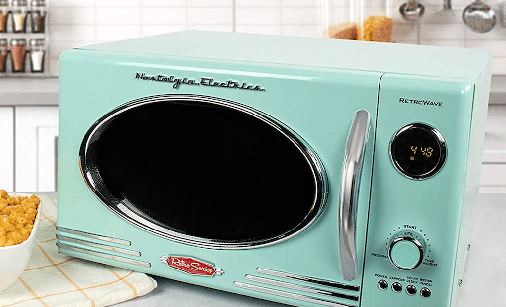 Nostalgia Electric retro microwave sitting on kitchen countertop