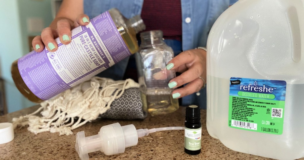 pouring castille soap into a soap container