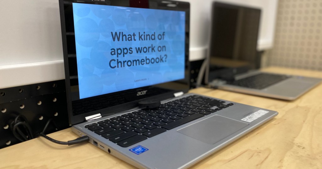 silver chromebook on shelf