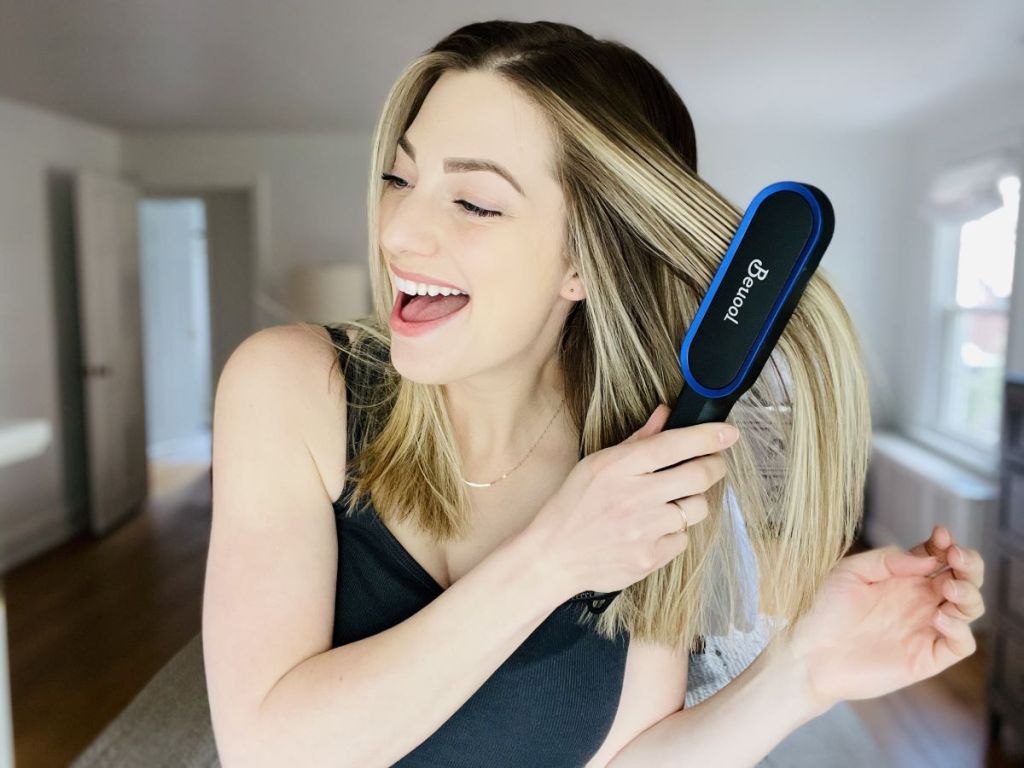 woman straightening her hair