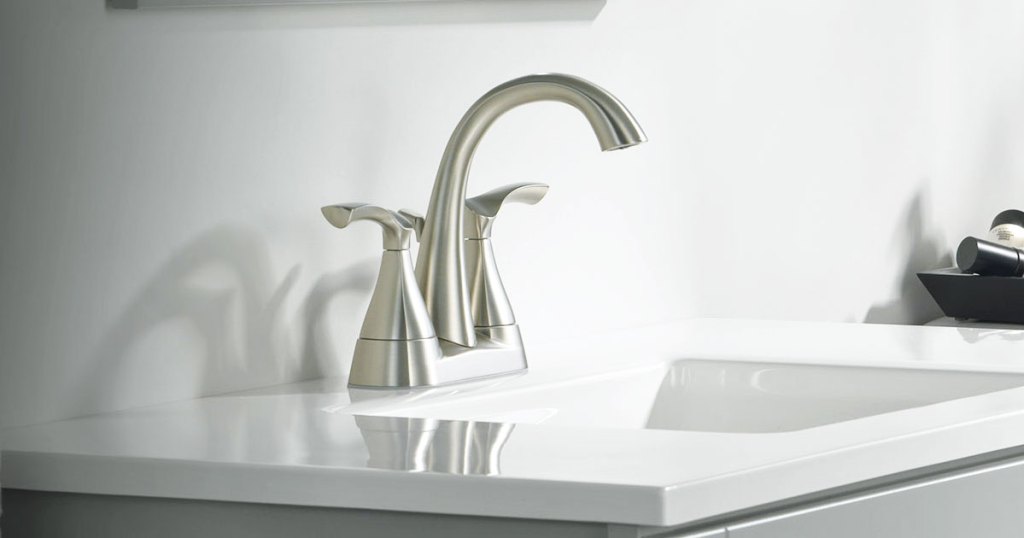 two handled faucet on bathroom sink