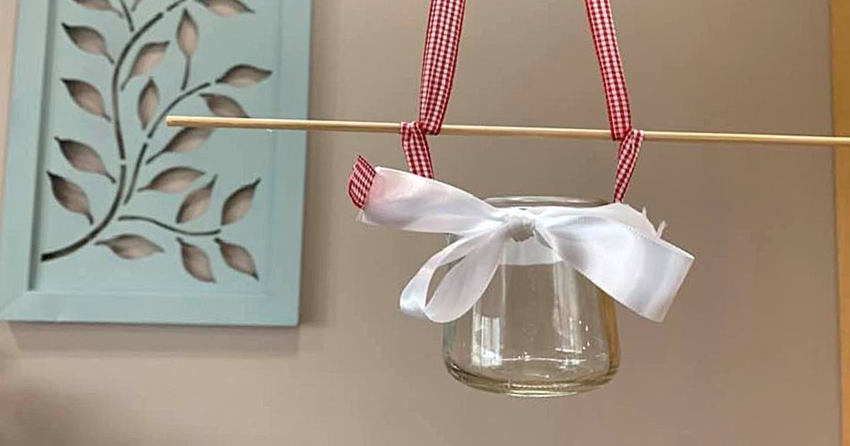 diy glass bird feeder with white ribbon