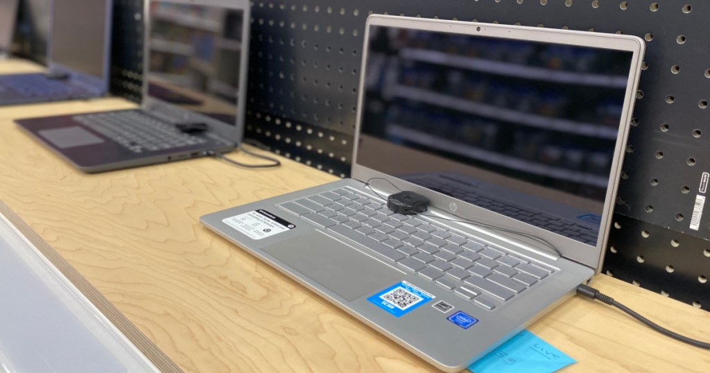 silver computer on shelf