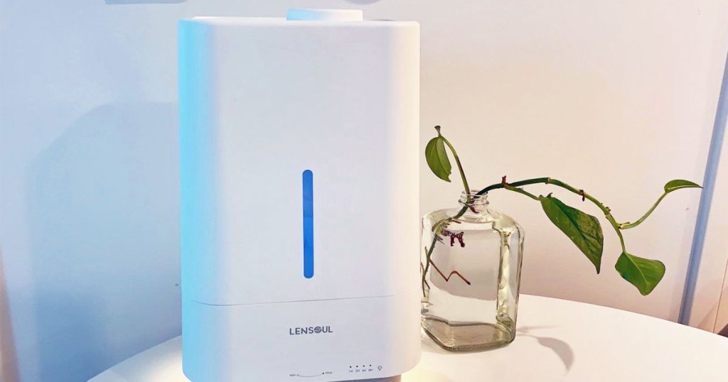 white humidifier next to plant