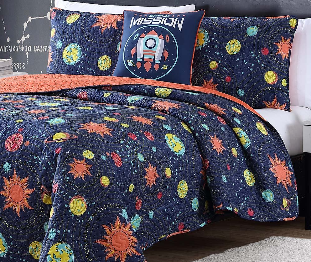 bed with space bedding on it