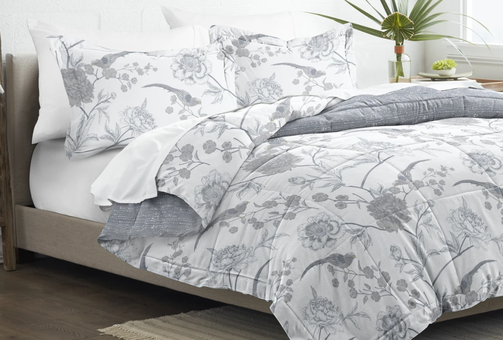 floral comforter on a bed