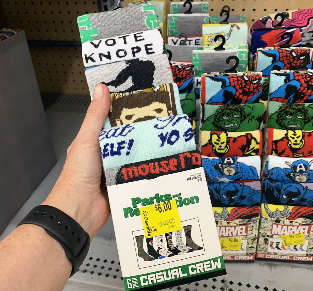 person holding up 6-pack of parks & rec themed socks