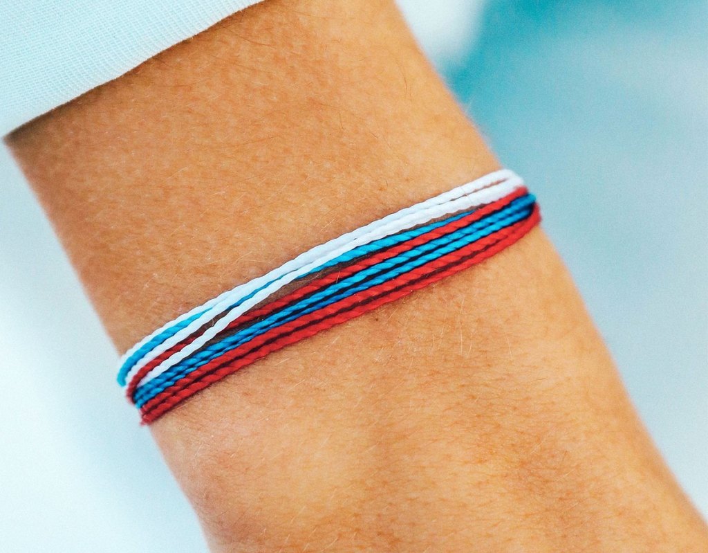 red white and blue bracelet on wrist