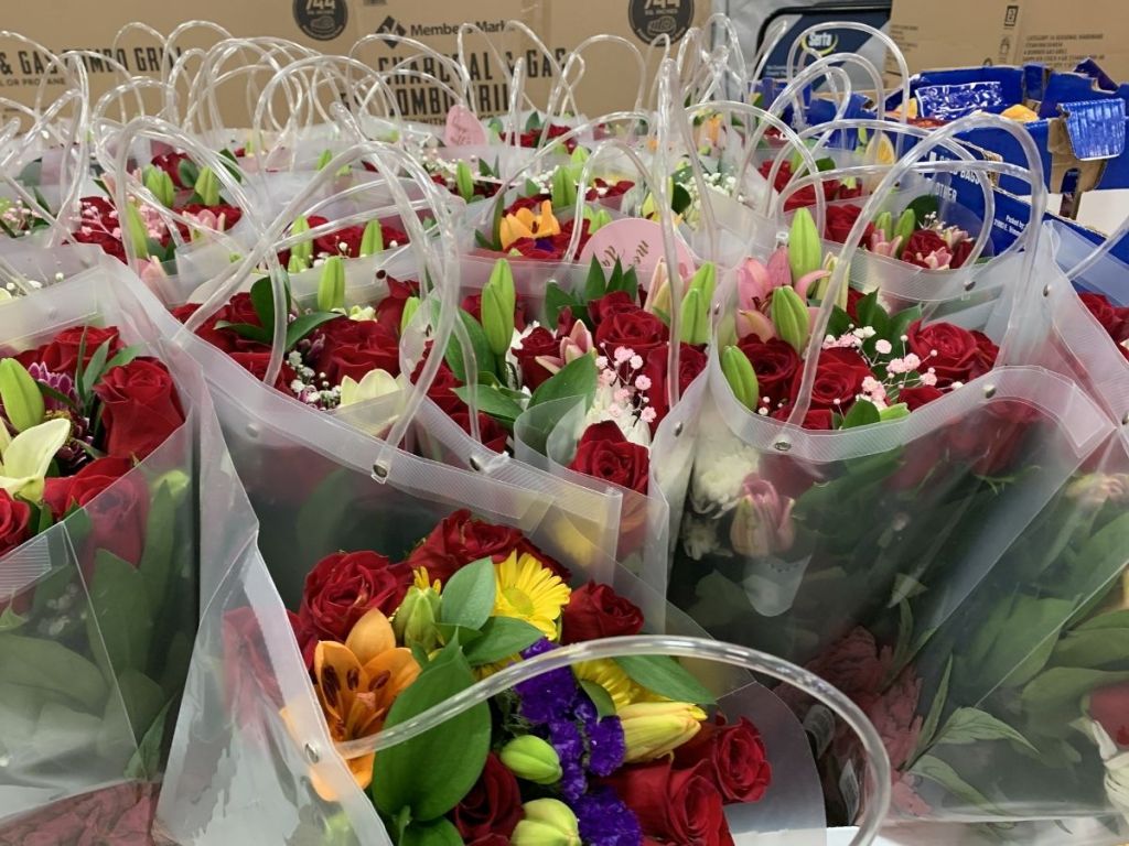 rose vase flower arrangements in clear bag