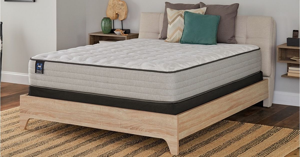 Sealy mattress on wood base