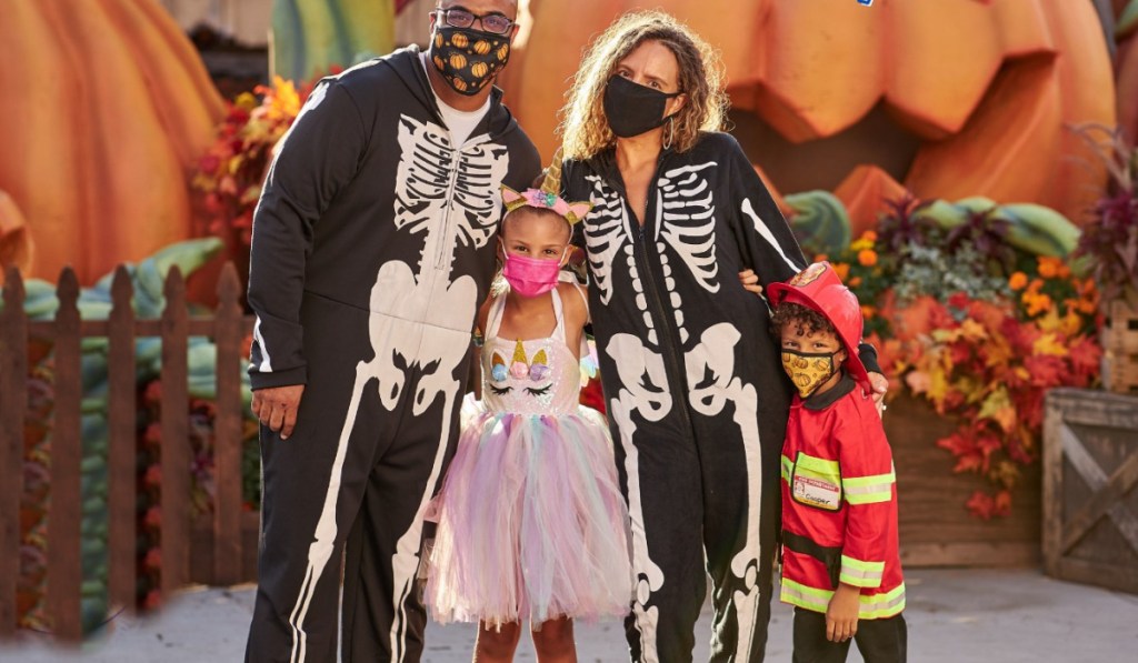 family wearing masks at halloween