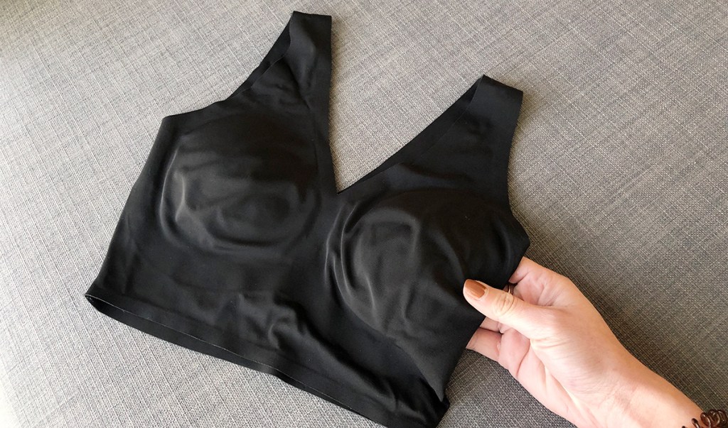 hand touching black calvin klein sports bra from amazon prime day