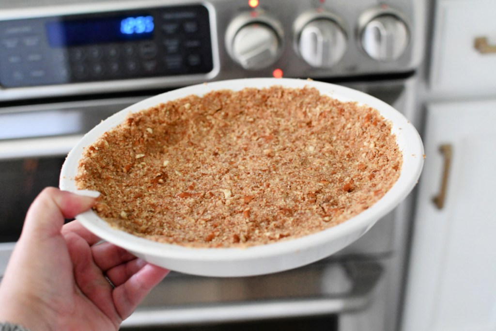 crushed pretzel pie crust going into the oven