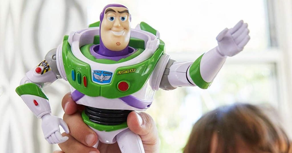 child holding up buzz lightyear action figure in air