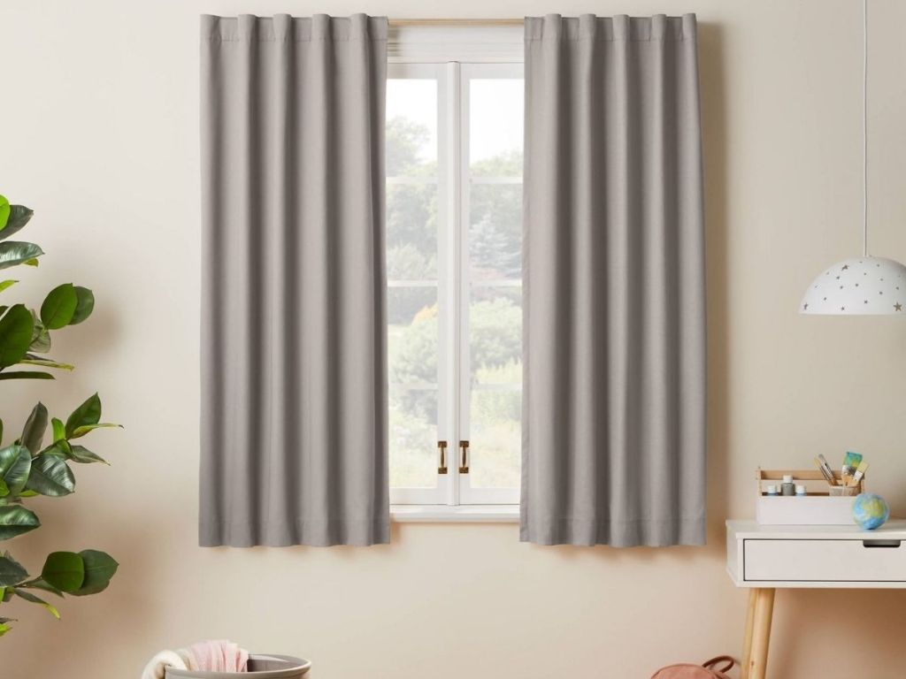 gray curtains hanging in kids room