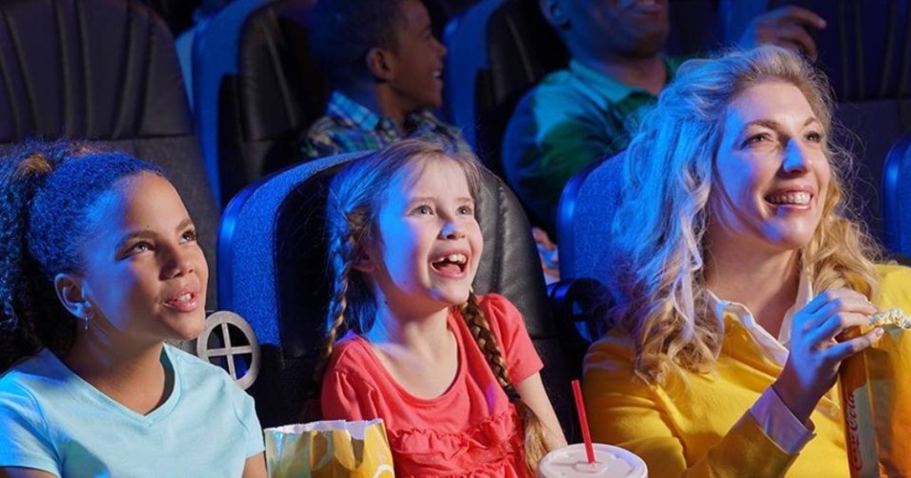 kids with woman at movie theater