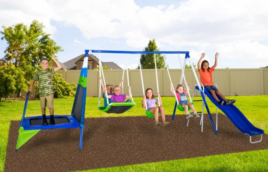 swing set with kids playing outside