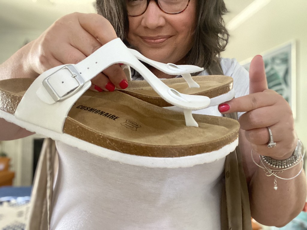 woman holding a pair of Cushionaire Leah Shoes