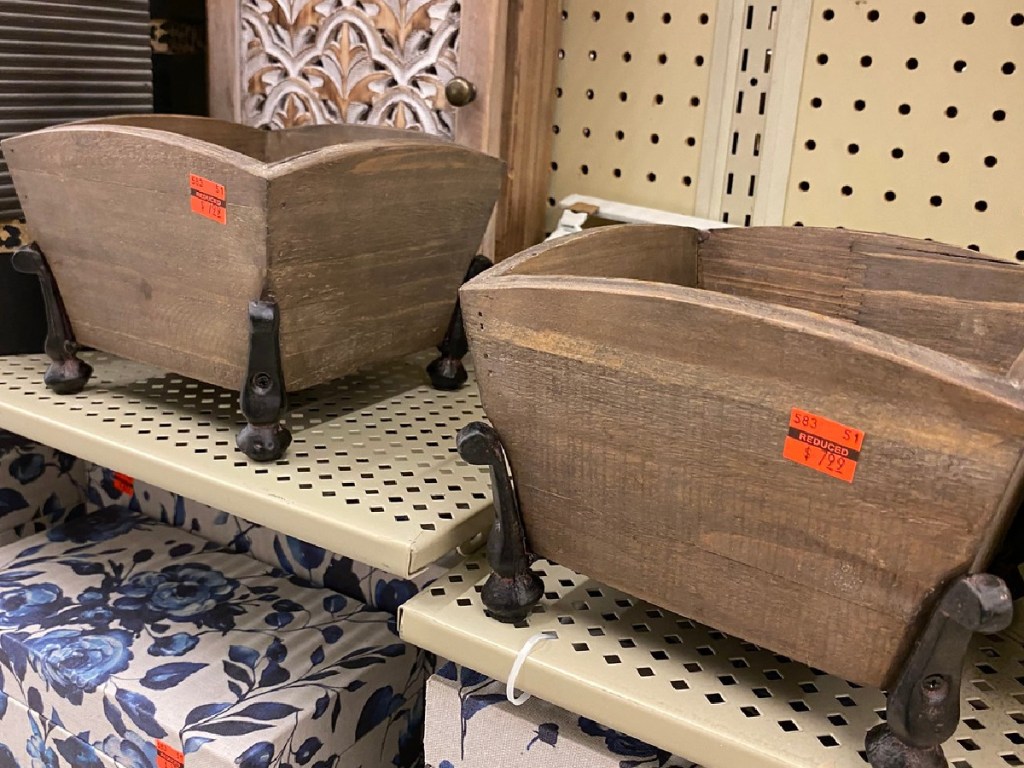 store display showing wooden boxes with prices on them