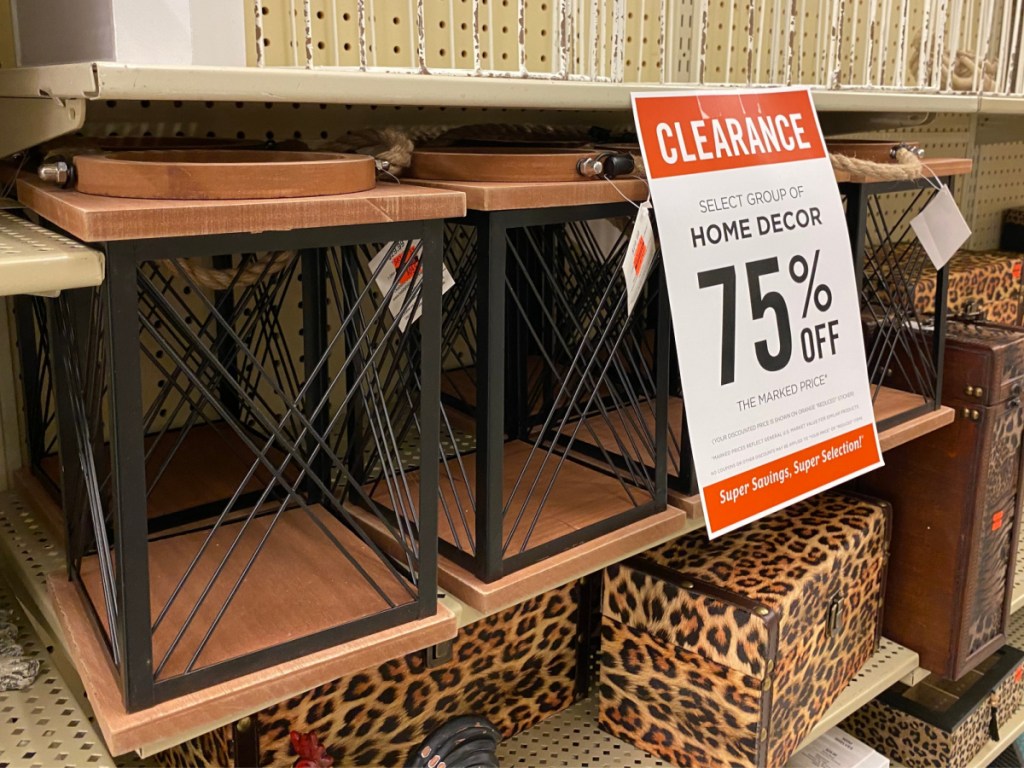 store shelf with wood laterns by clearance sign