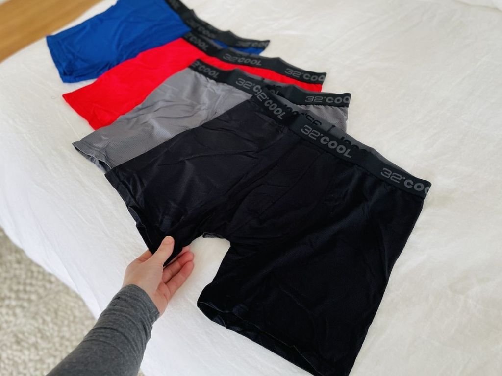 four pairs of men's 32 Degrees boxer briefs on bed